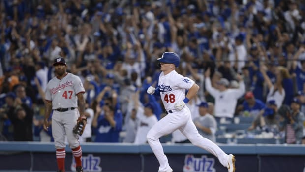 Oct 3, 2019; Los Angeles, CA, USA; Los Angeles Dodgers shortstop Gavin Lux (48) rounds the bases off a solo home run as Washington Nationals first baseman Howie Kendrick (47) looks on during the eighth inning in game one of the 2019 NLDS playoff baseball series at Dodger Stadium. Mandatory Credit: Gary A. Vasquez-USA TODAY Sports